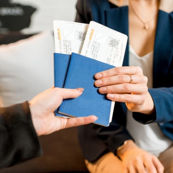 A person giving tickets to a lady