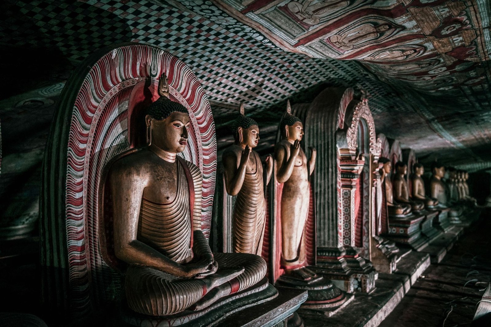 Painted Buddha statues inside Dambulla cave temple