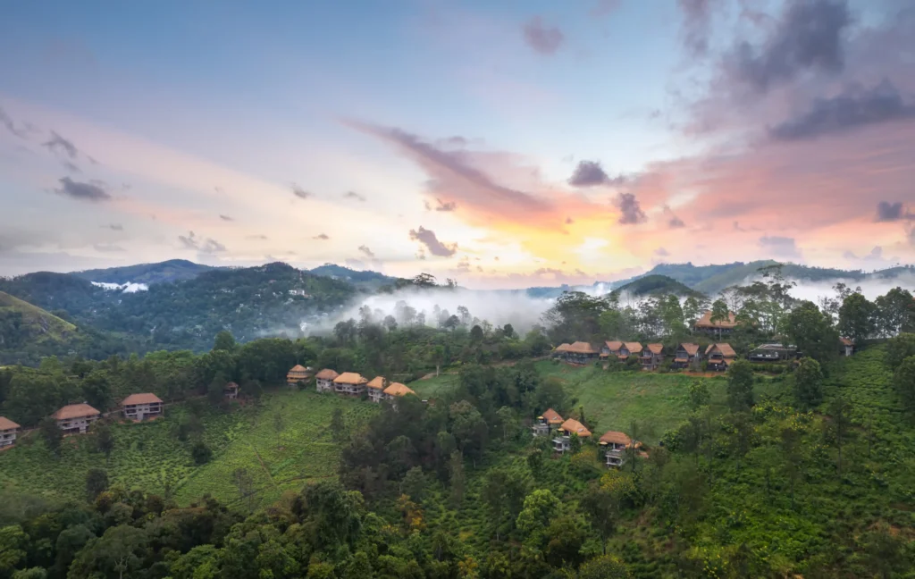 Hillside chalets above misty hills at 98 Acres Resort, Ella
