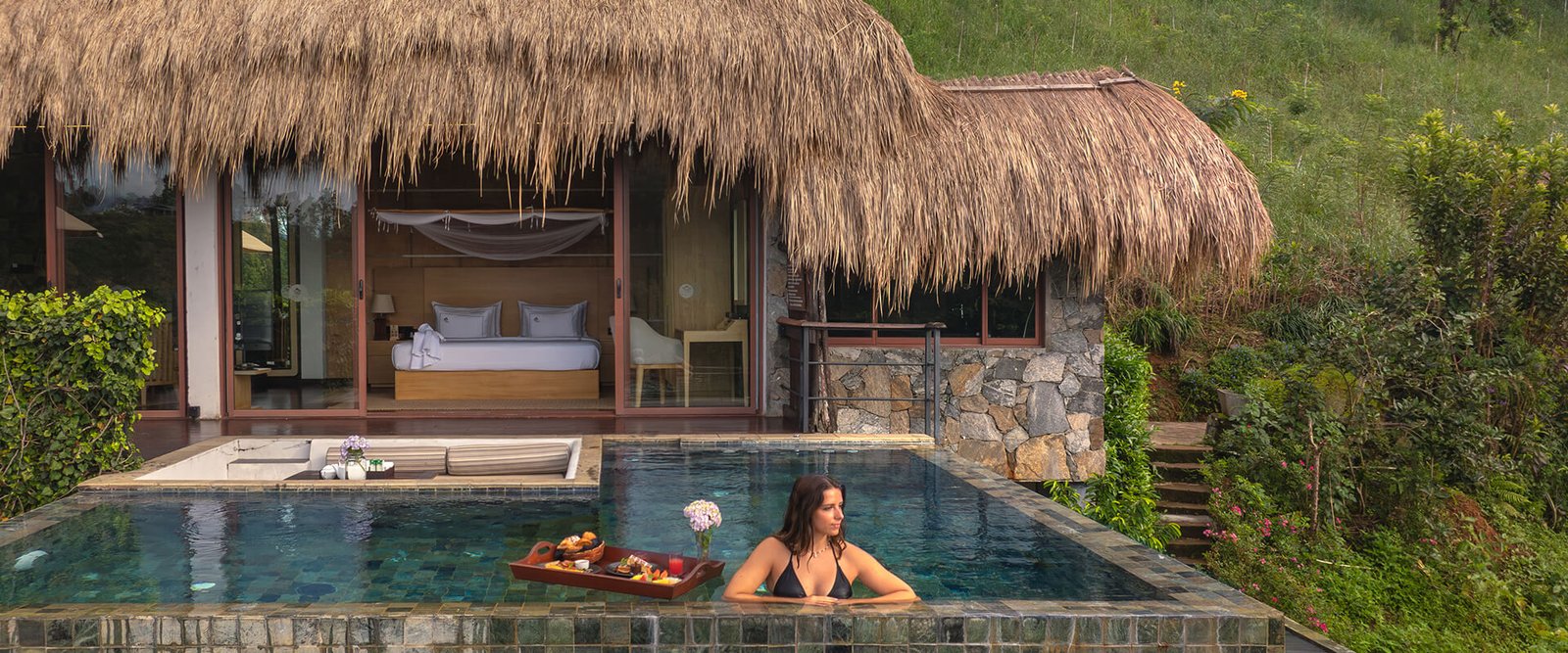 Guest in a private plunge pool overlooking the valley at 98 Acres Resort, Ella