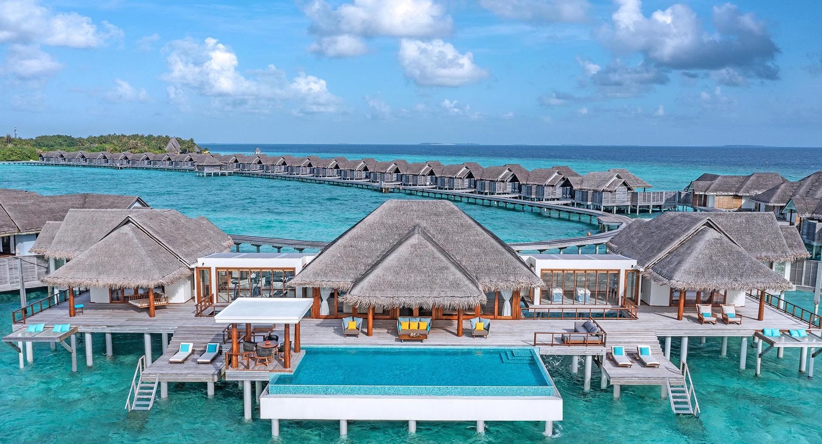 Overwater villas and jetty at Anantara Kihavah
