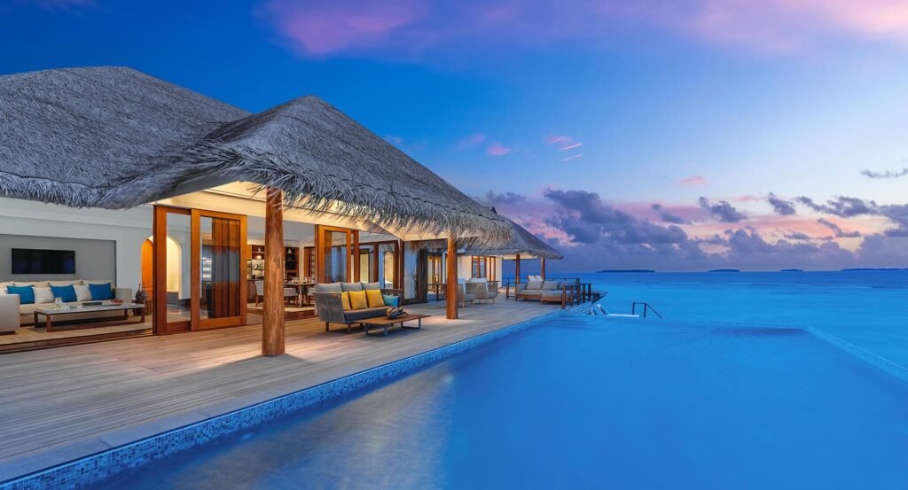 Overwater villa opening onto the sea at Anantara Kihavah