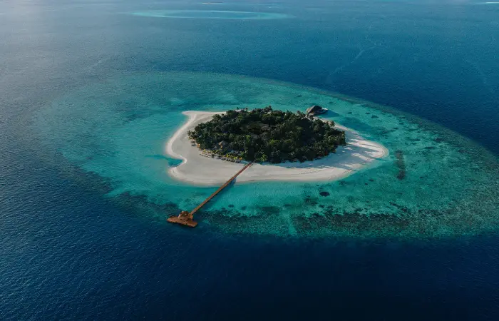Aerial view of Banyan Tree Vabbinfaru island and its jetty