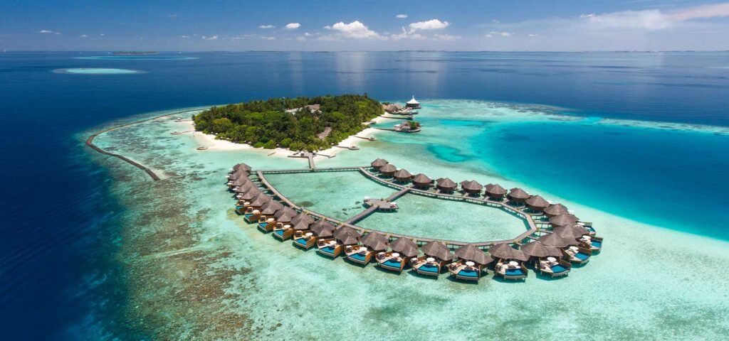 Aerial view of Baros Maldives island and its overwater villas