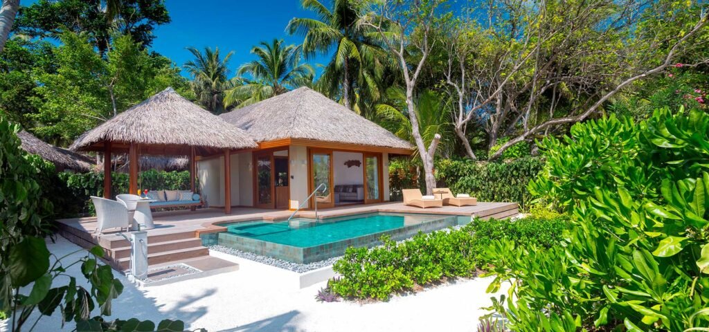 Beach villa with a private pool at Baros Maldives