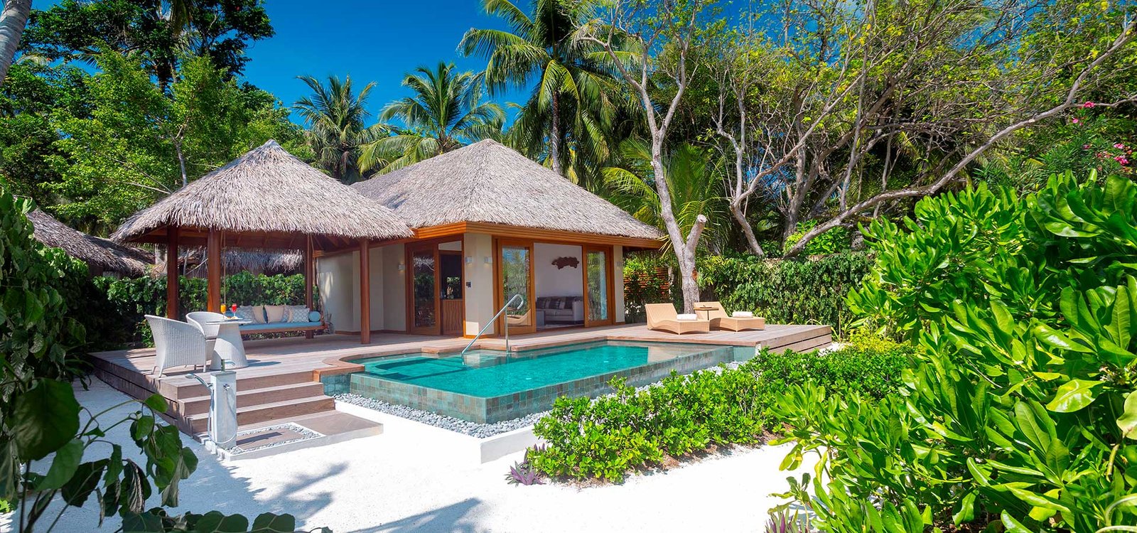 Beach villa with a private pool at Baros Maldives