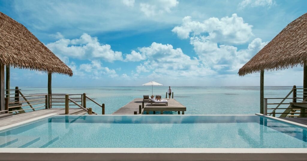 Infinity pool and thatched pavilion at COMO Cocoa Island