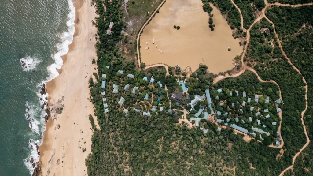 Aerial view of the beachside camp and surf at Cinnamon Wild Yala