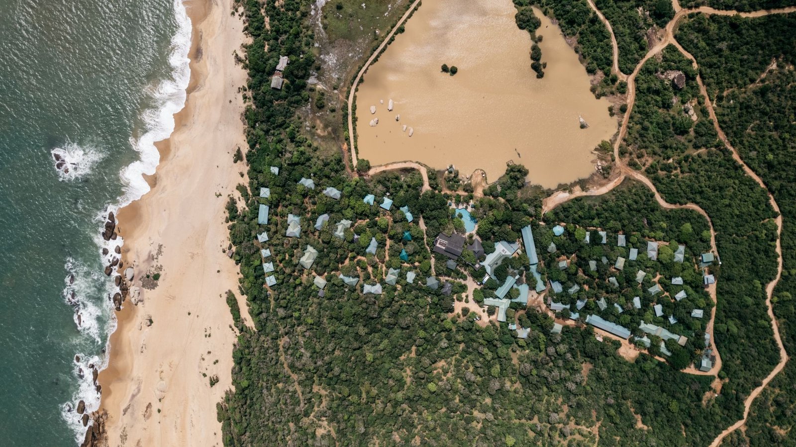 Aerial view of the beachside camp and surf at Cinnamon Wild Yala