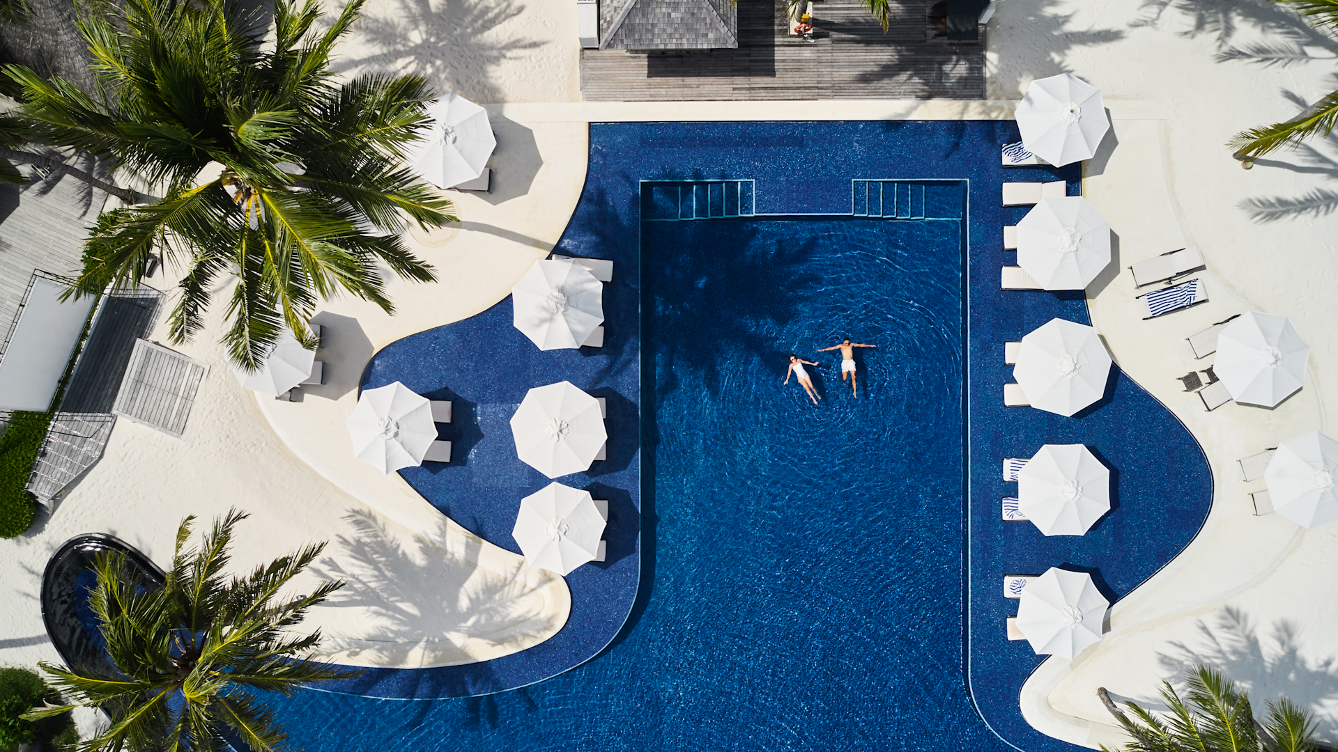 Aerial view of the resort pool at Conrad Maldives Rangali Island