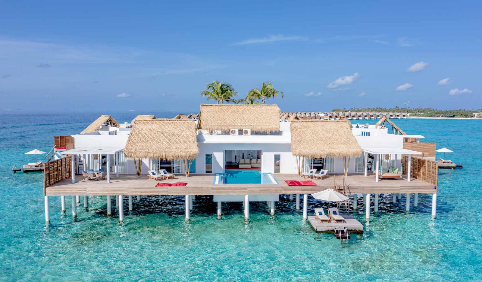 Overwater villas with private pools at Emerald Maldives Resort and Spa