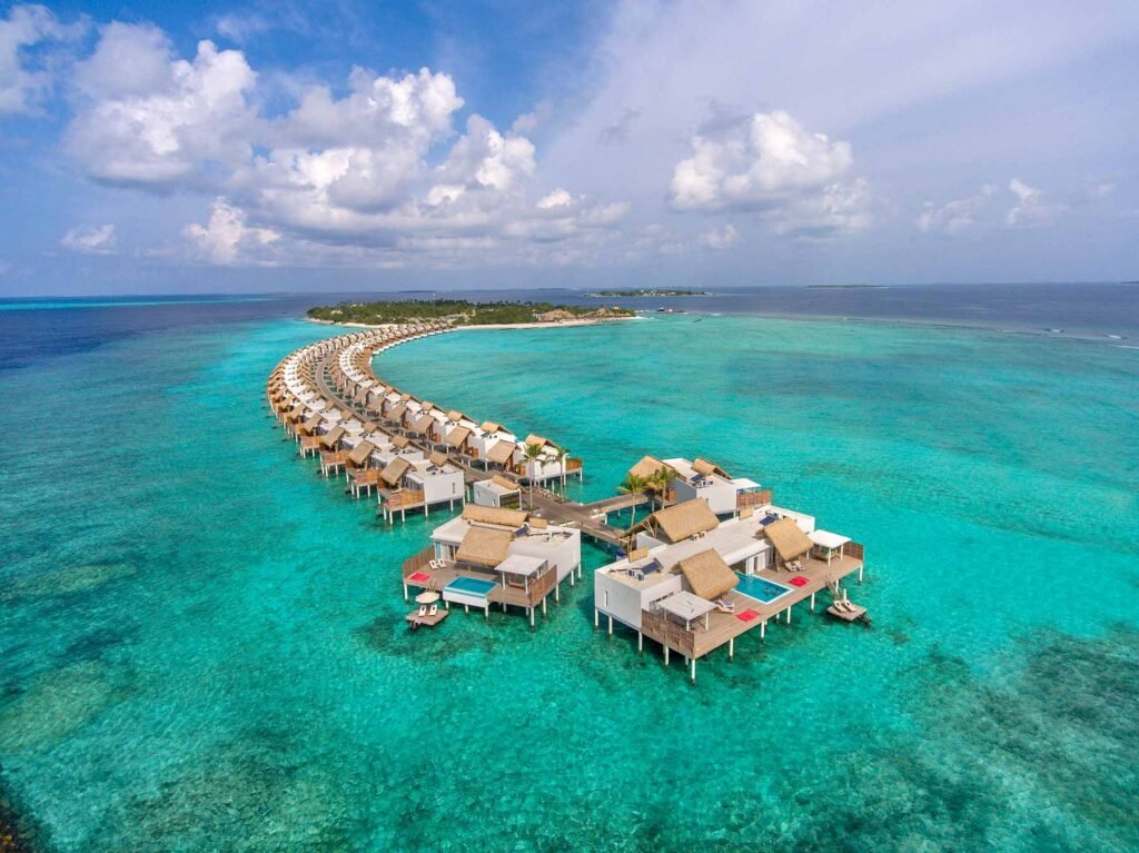 Aerial view of the overwater villas at Emerald Maldives Resort and Spa