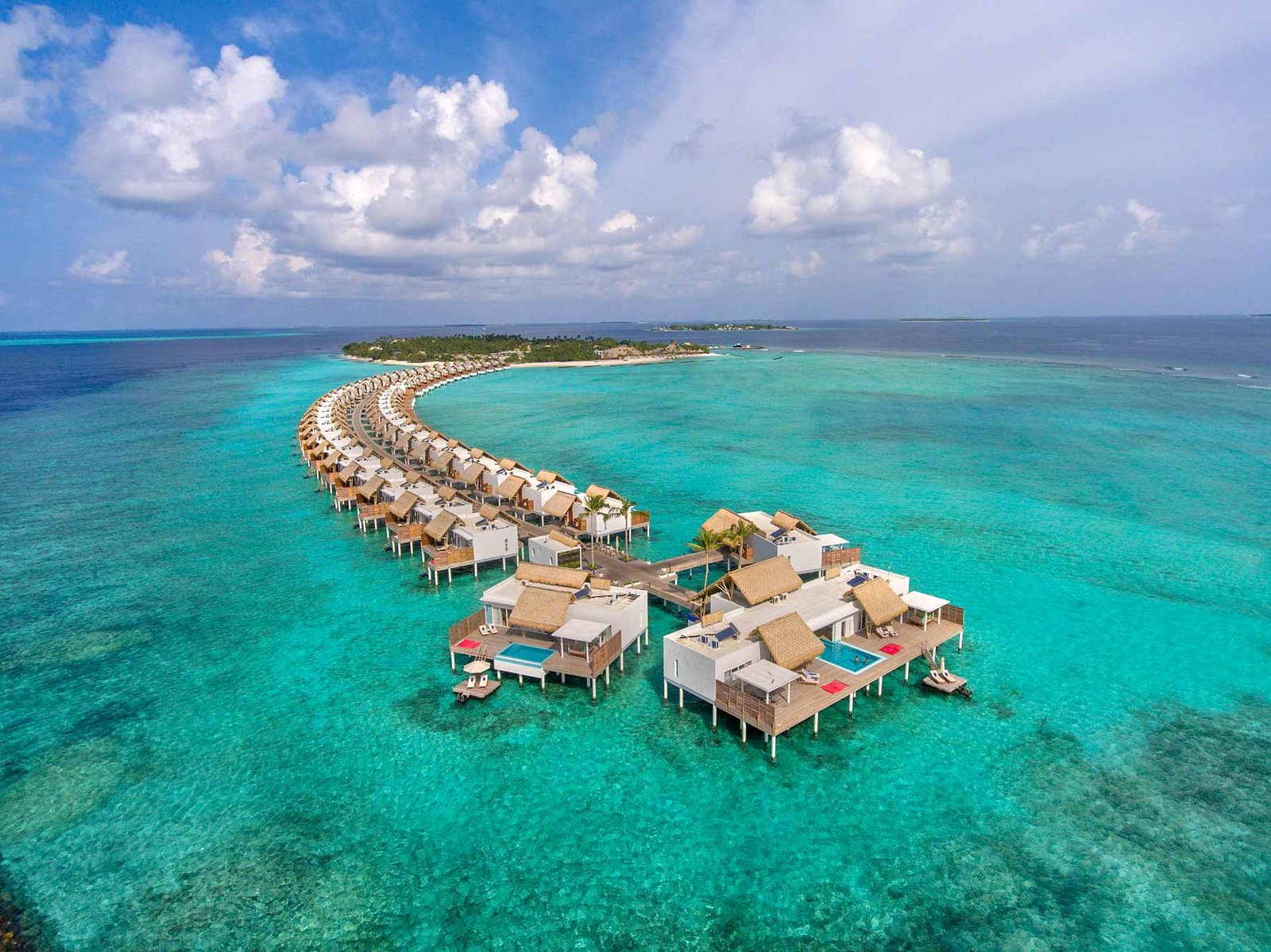 Aerial view of the overwater villas at Emerald Maldives Resort and Spa