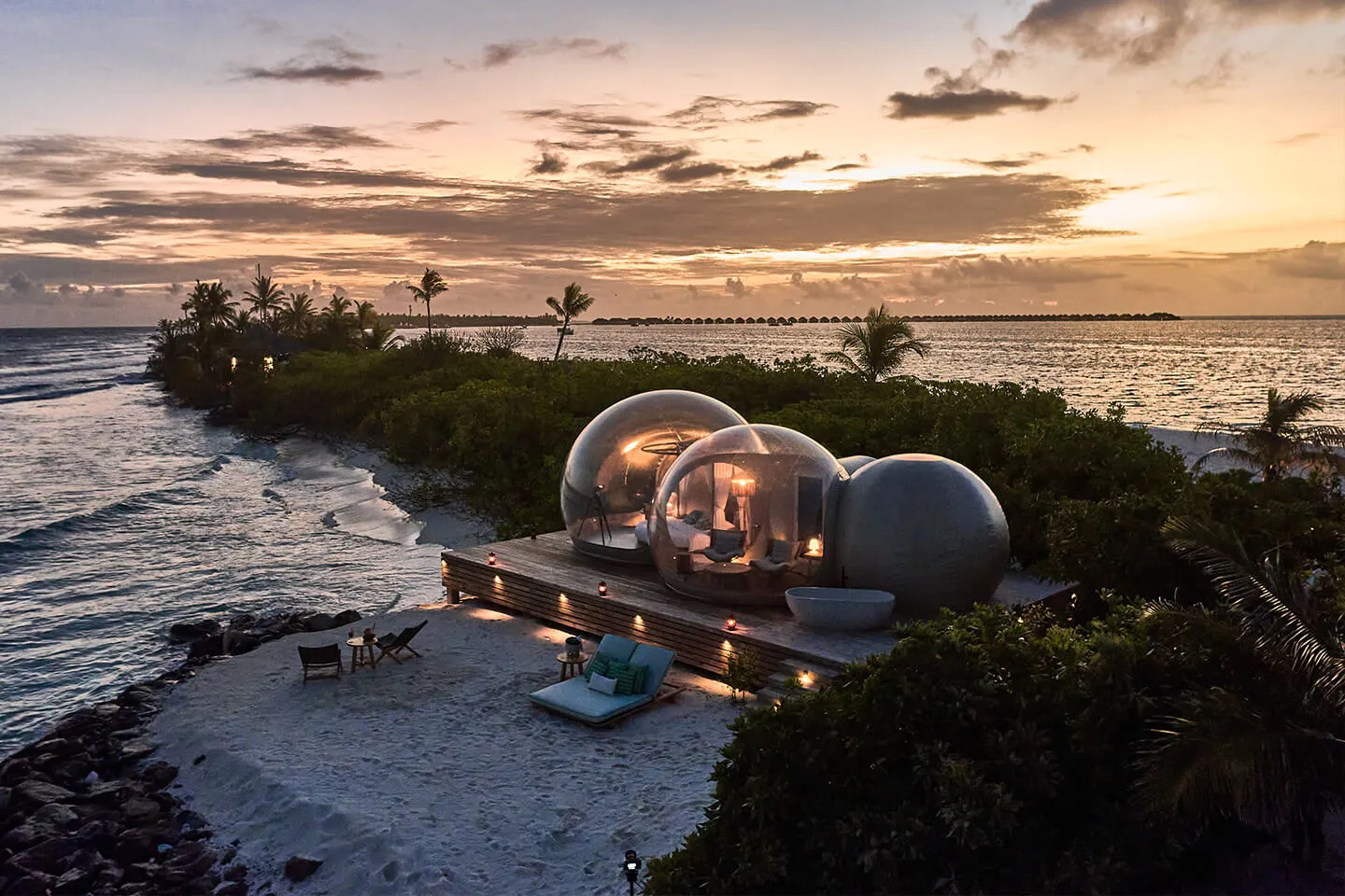 Bubble tents on the beach at sunset at Finolhu, Baa Atoll