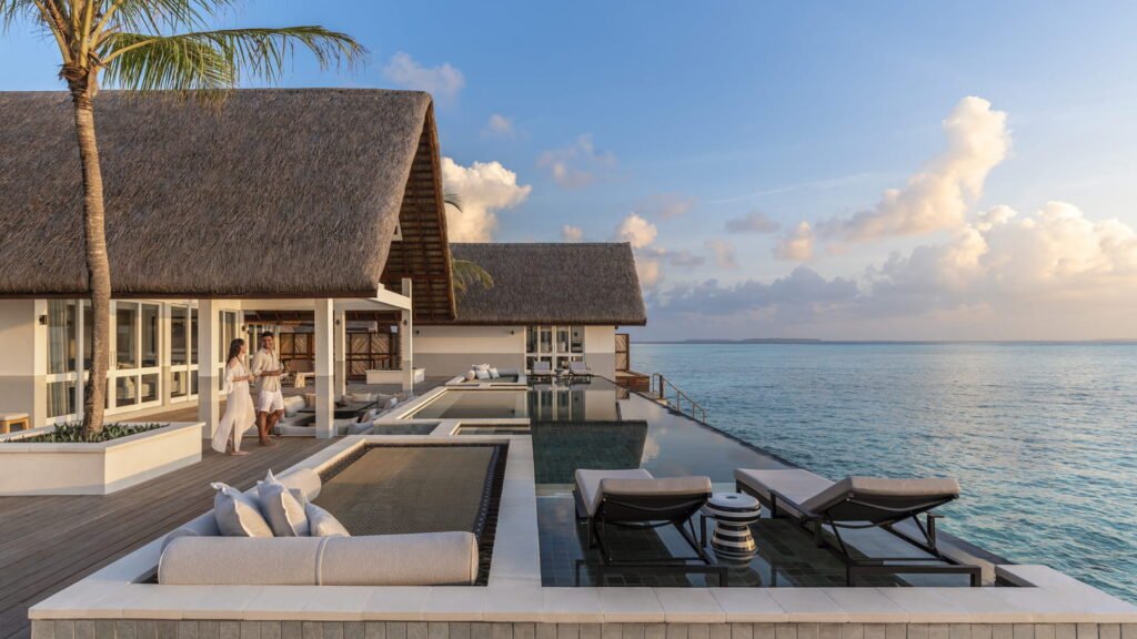 Villa and private pool at sunset at Four Seasons Landaa Giraavaru