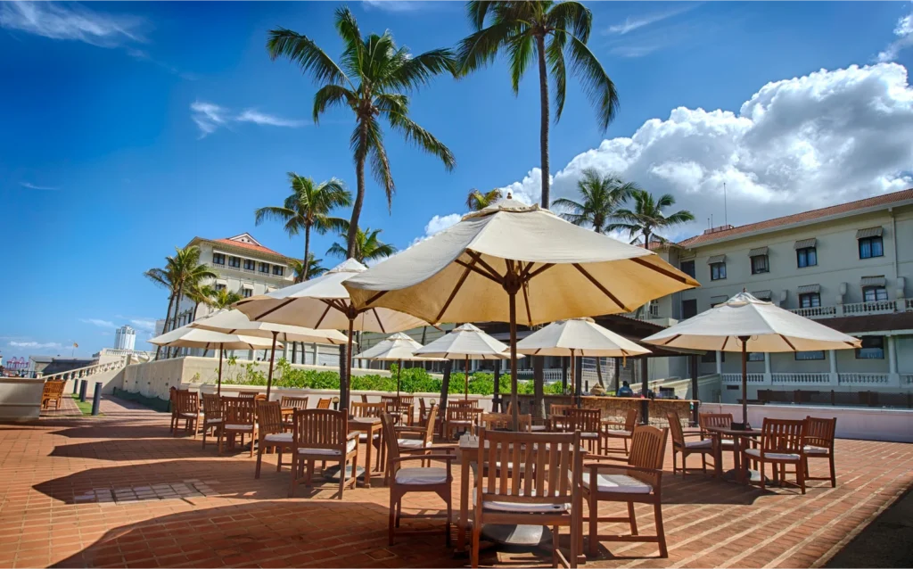 Poolside terrace with parasols at Galle Face Hotel, Colombo