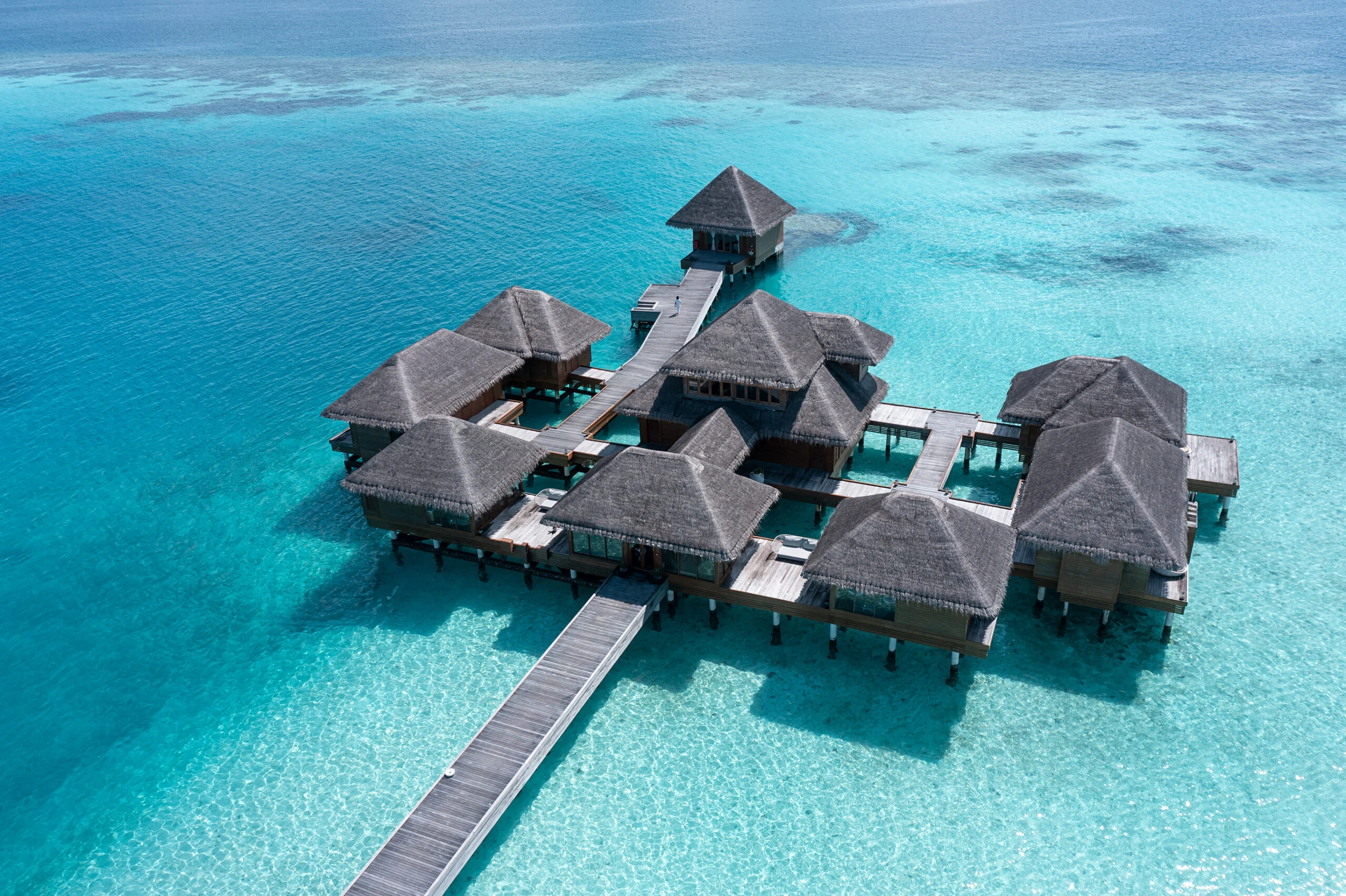 Aerial view of the overwater villas at Huvafen Fushi