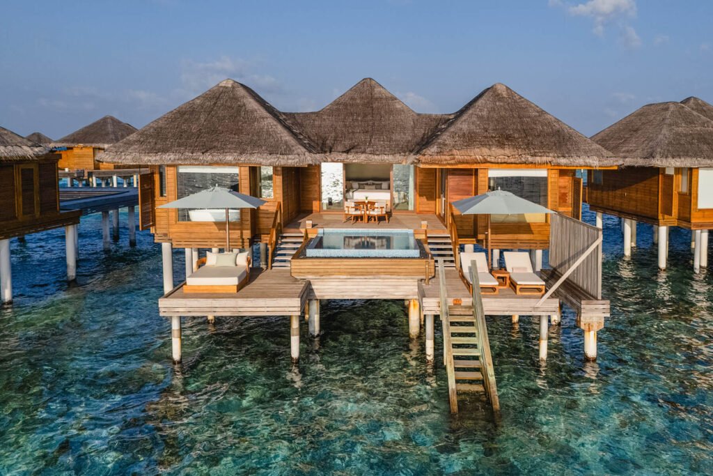 Overwater villas with steps into the lagoon at Huvafen Fushi