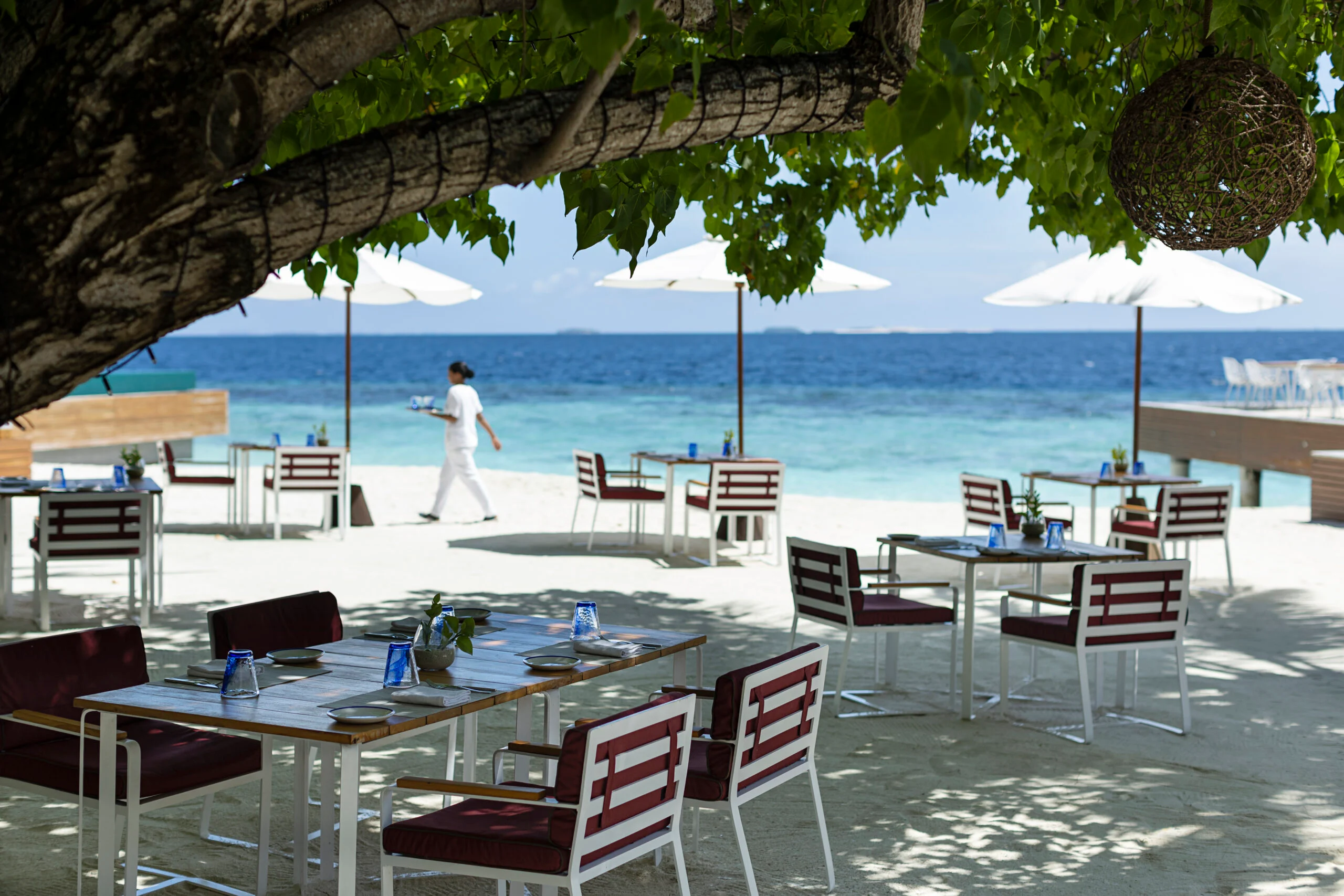 Beachside restaurant terrace at Huvafen Fushi
