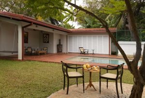 Courtyard, pool and dining table at Jetwing Mahesa Bhawan, Jaffna