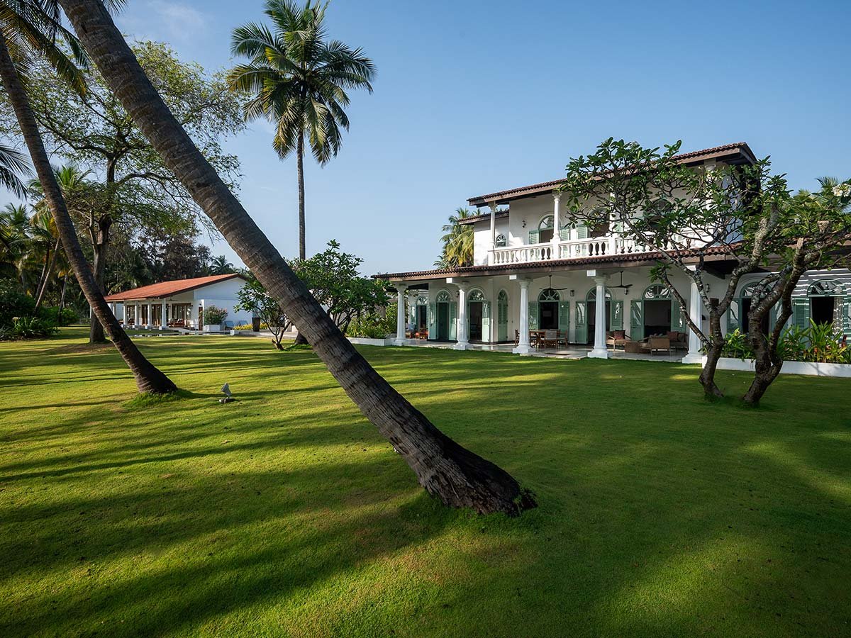 Colonial beach house and lawn at Kalkudah Beach House