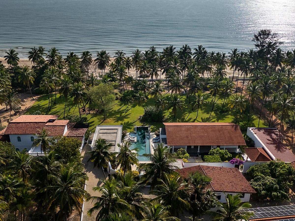 Aerial view of the house among the palms at Kalkudah Beach House