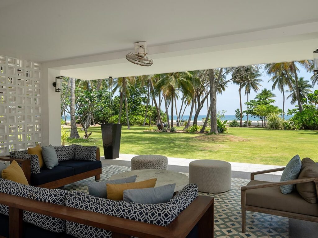 Veranda overlooking the lawn at Kalkudah Beach House