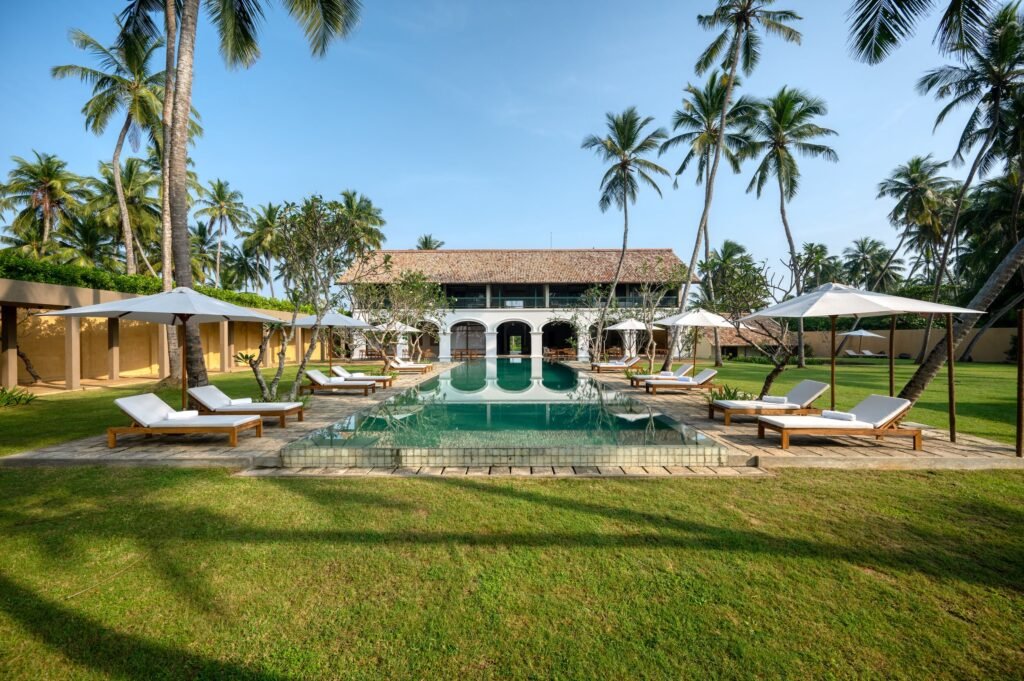 Villa, pool and loungers at Kayaam House, Tangalle