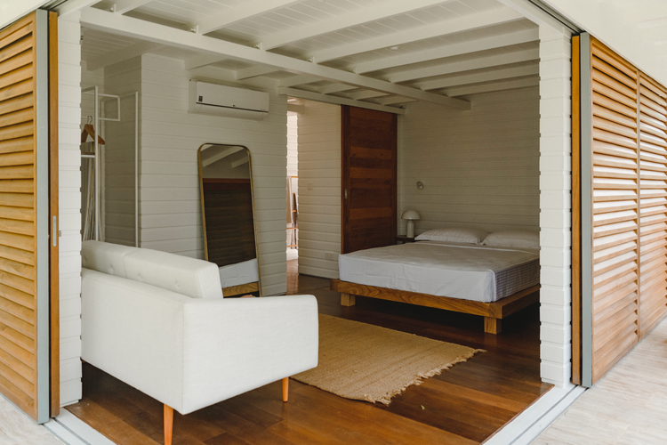 Bedroom with louvred shutters at Kurulu Bay