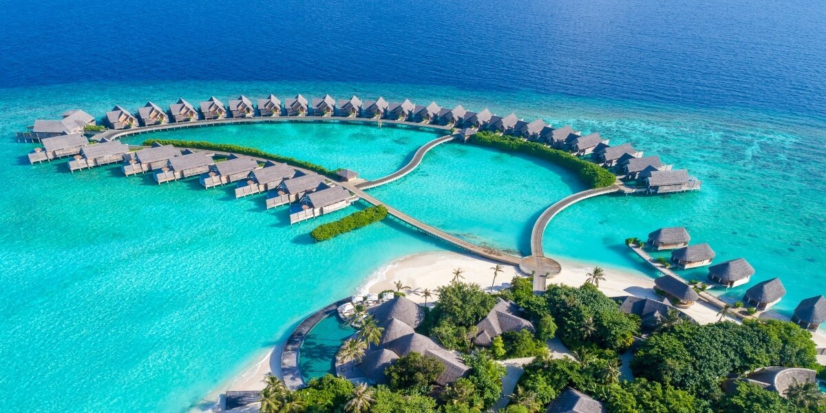 Aerial view of Milaidhoo Island and its overwater villas