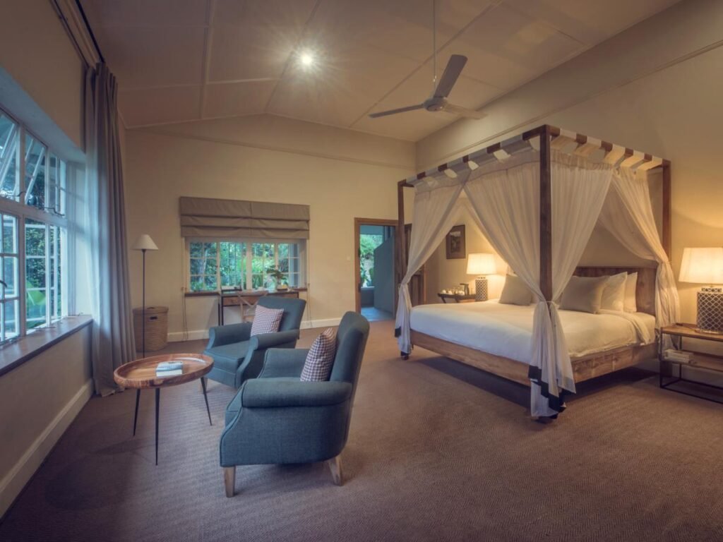 Bedroom with a four-poster bed at Nine Skies, Ella