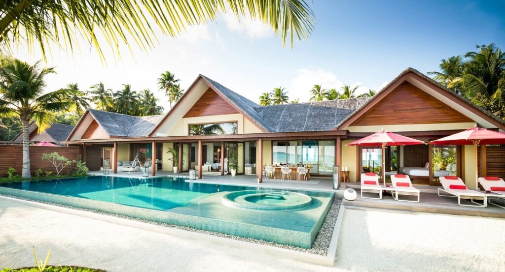 Beach villa, pool and loungers at Niyama Private Islands