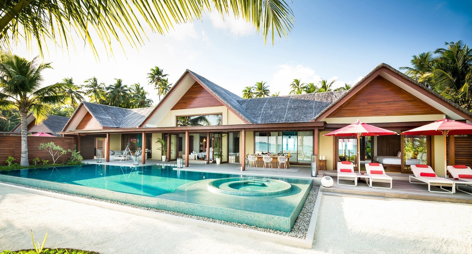 Beach villa, pool and loungers at Niyama Private Islands
