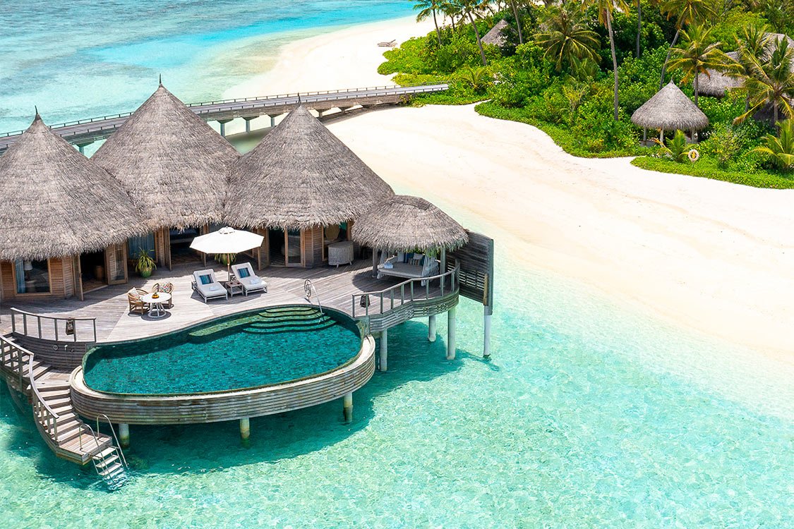 Beach villa with a curved private pool at The Nautilus Maldives