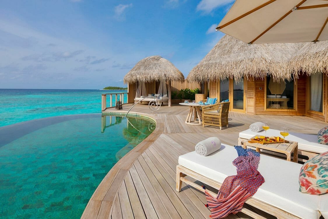Beach house terrace and loungers at The Nautilus Maldives