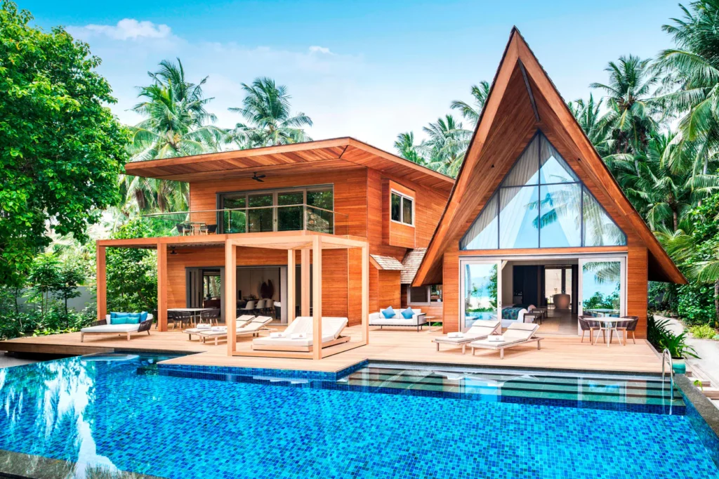 Timber villa and private pool at The St. Regis Maldives Vommuli Resort