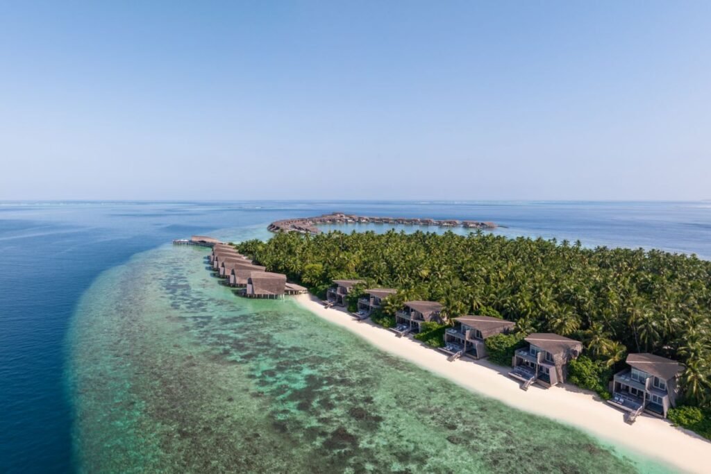Aerial view of the island and villas at The St. Regis Maldives Vommuli Resort