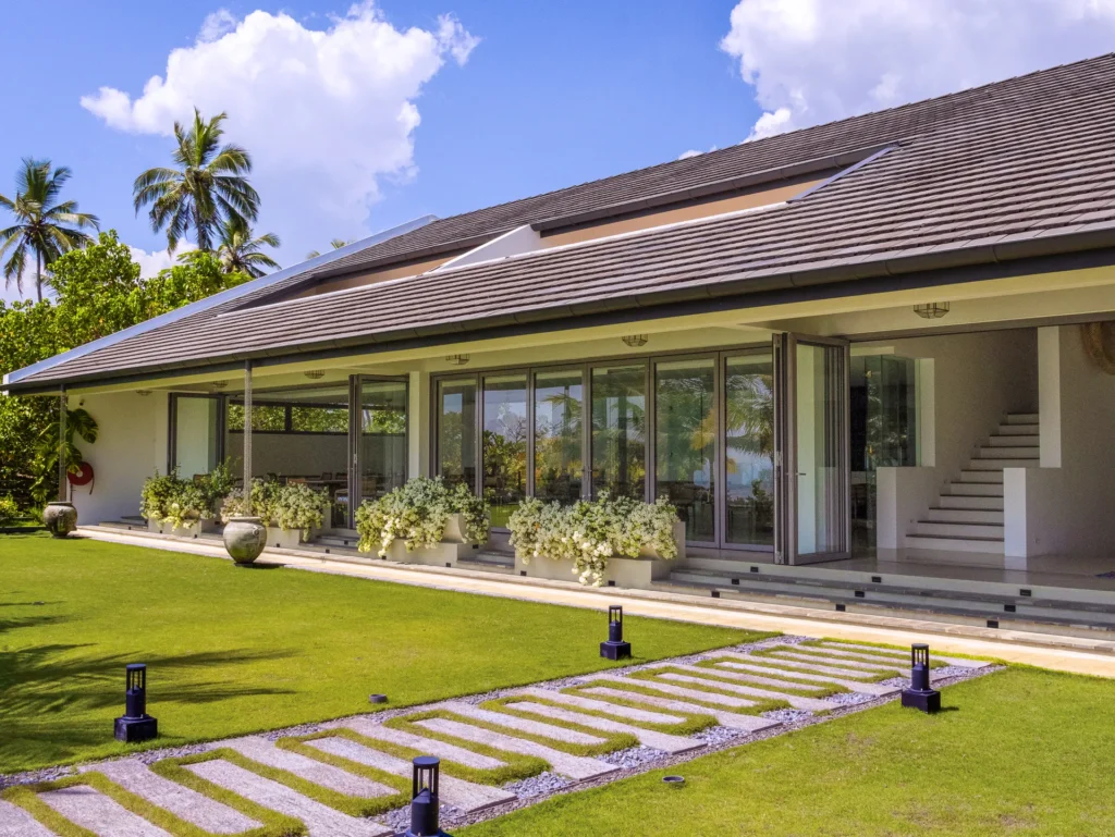 Villa exterior and lawn at Uga Prava, Tangalle