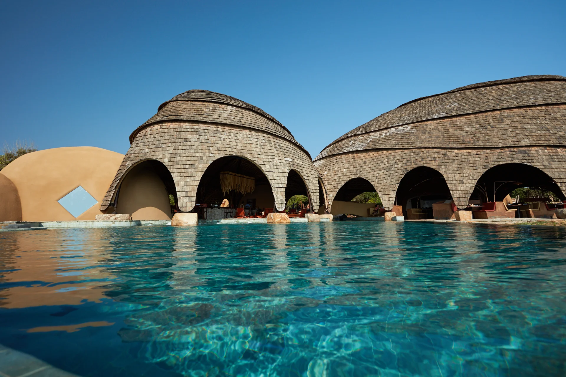 Arched main lodge and pool at Wild Coast Tented Lodge, Yala
