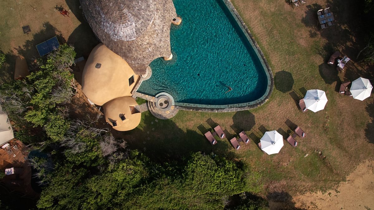 Aerial view of the pool and tented suites at Wild Coast Tented Lodge, Yala